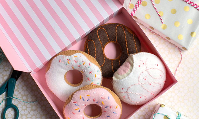 felt donuts in donut box next to gifts