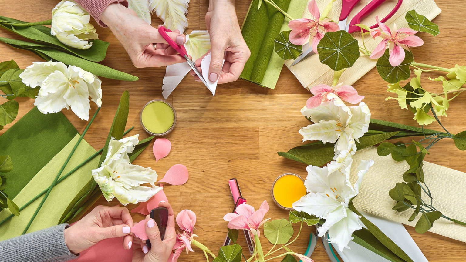 Overhead picture of hands making flowers