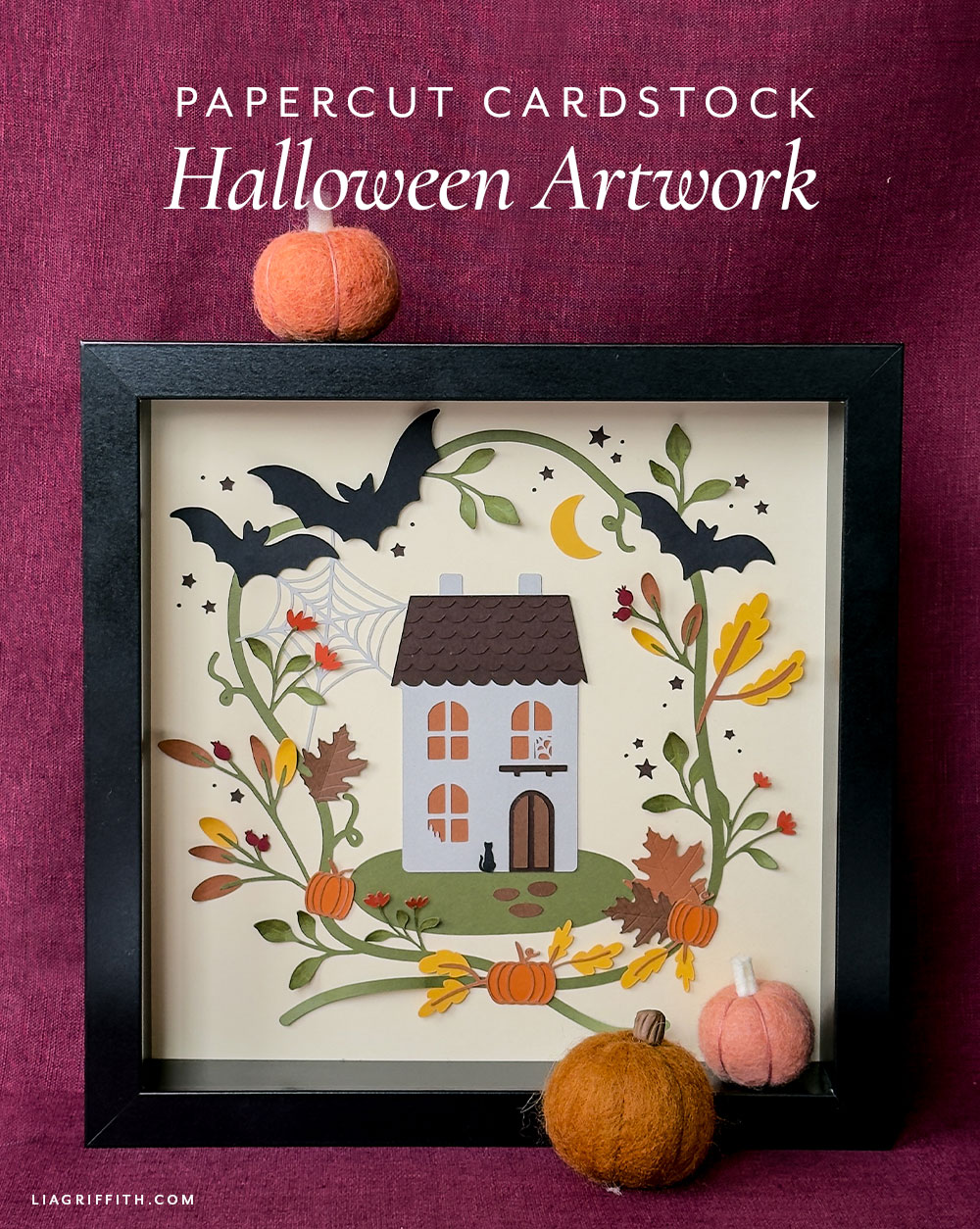 Papercut Halloween art in orange and brown cardstock inside a frame