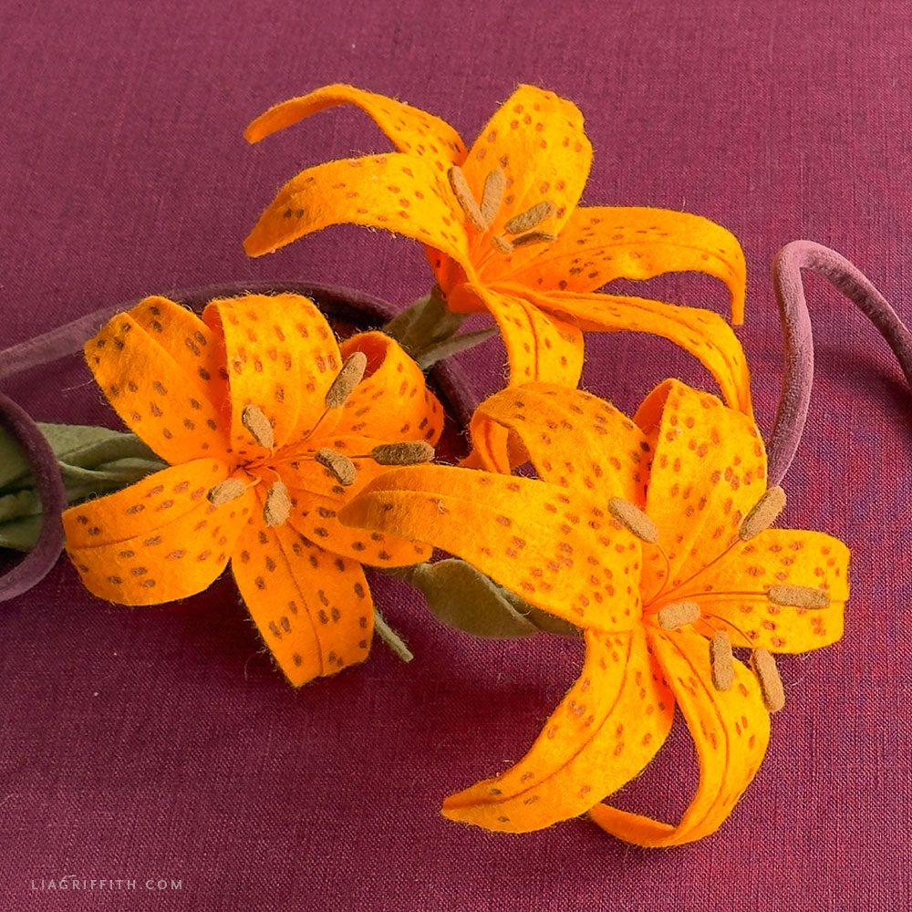 Orange felt tiger lily with curved petals and brown spots