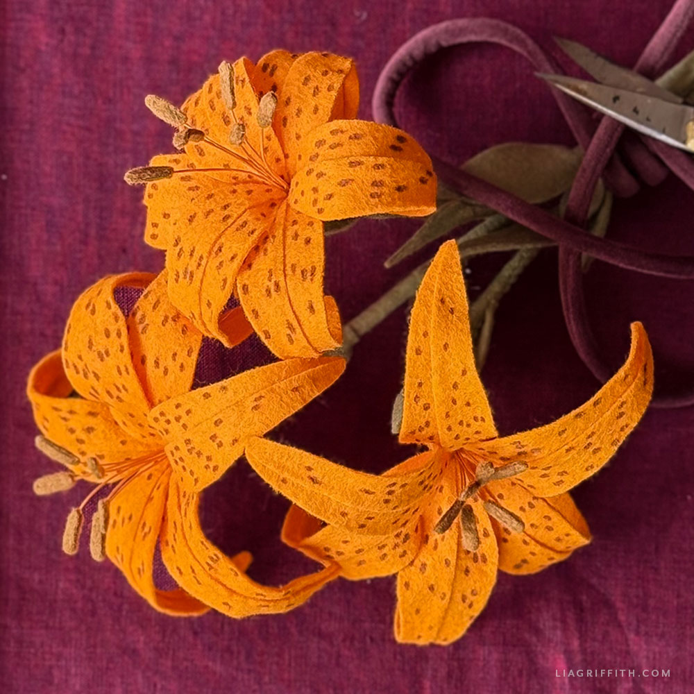Orange felt tiger lily with curved petals and brown spots