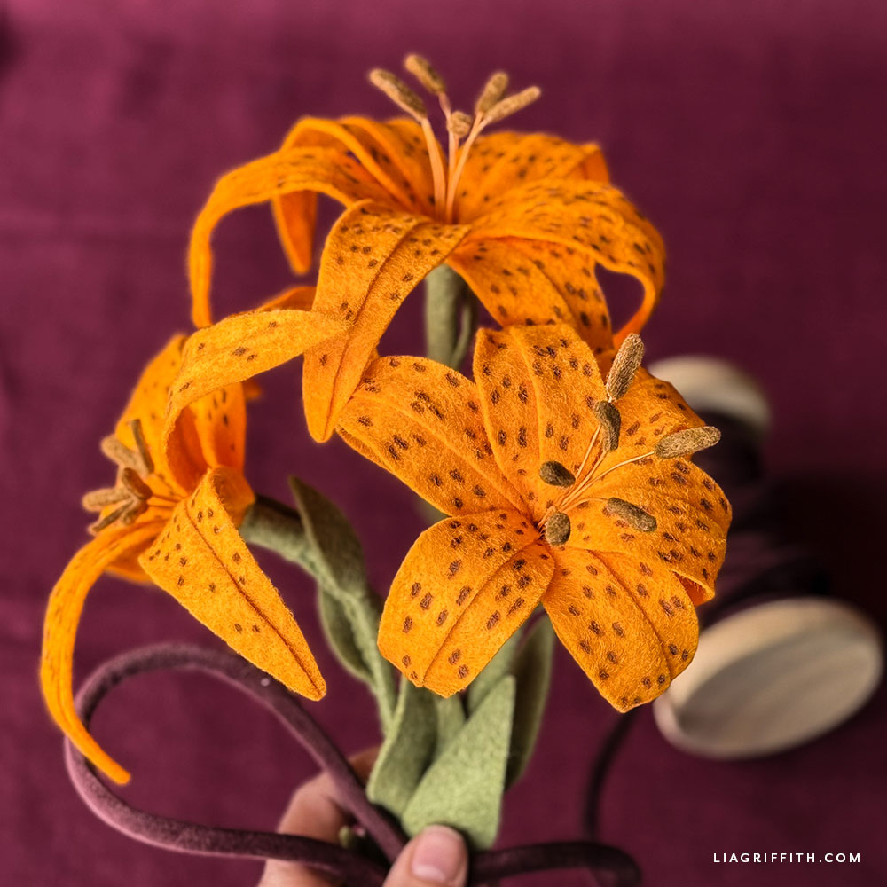 Orange felt tiger lily with curved petals and brown spots
